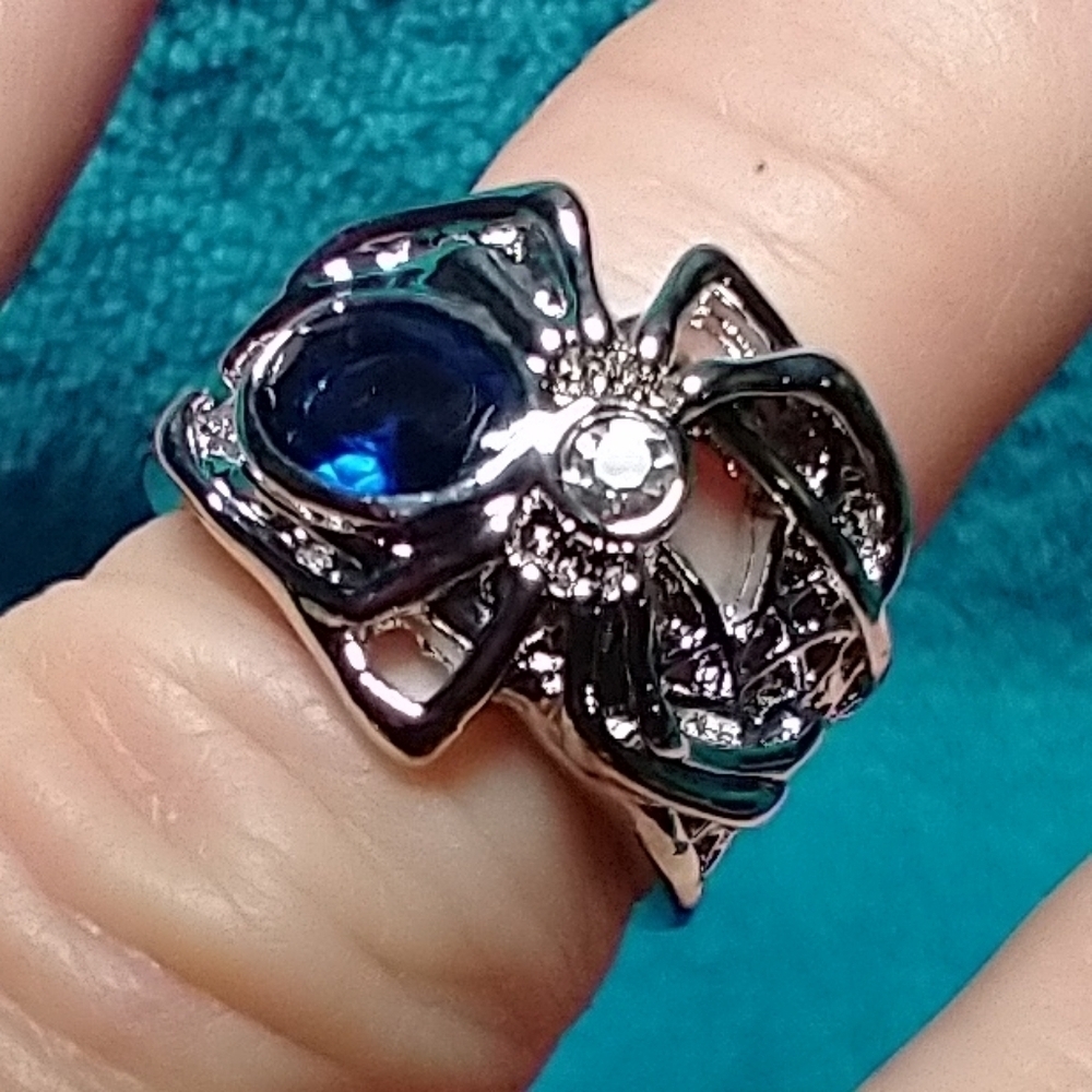 Silvertone spider web ring blue stone